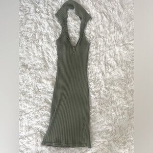 Stretchy green turtleneck mini dress in green